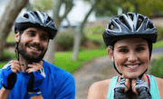 Couple wearing bicycle helmets